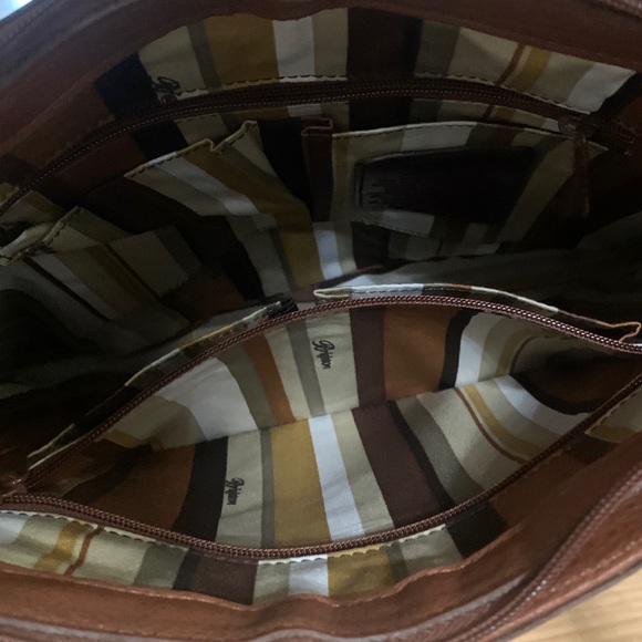 Brighton
Shoulder Bag Brown Leather Satchel
11"L x 3.5"W x 12"H - Picture 6 of 7